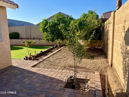 a view of a backyard with sitting area