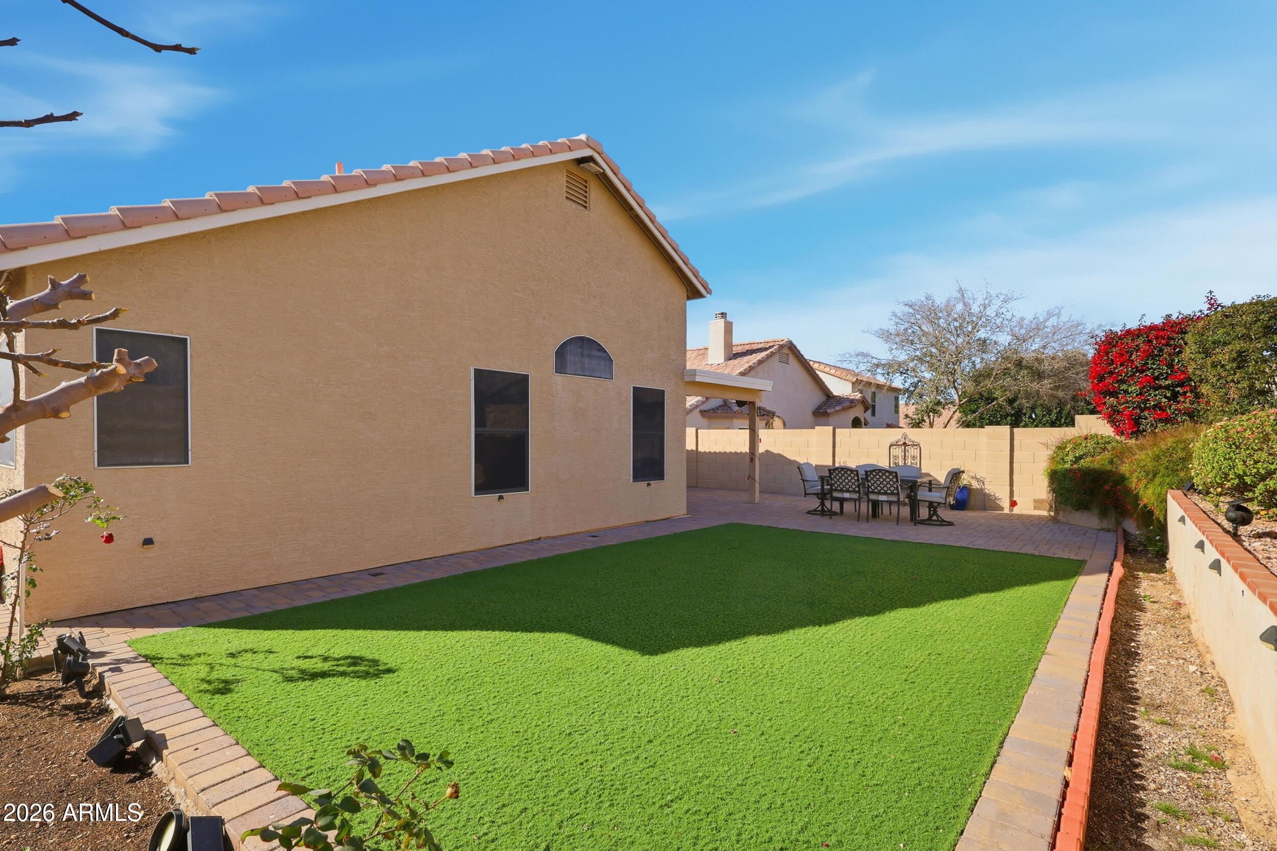 1516 East Marco Polo Road Phoenix, AZ 85024 - Photo 19 of 20 a view of a backyard with plants and a garden
