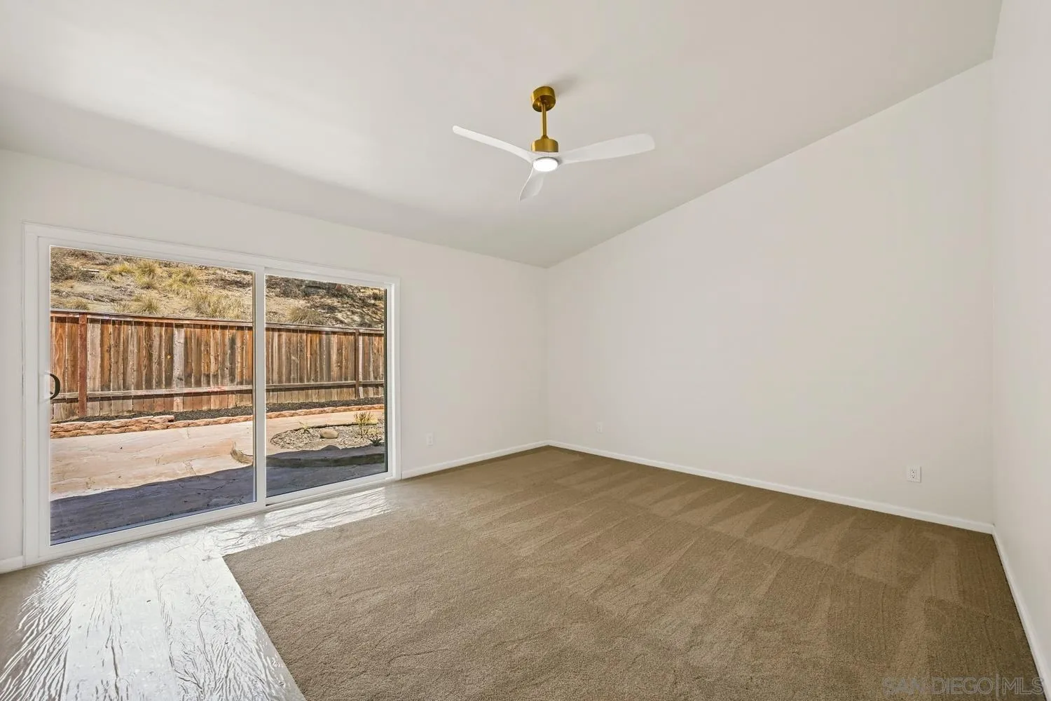 13010 Pomard Way Poway, CA 92064 - Photo 22 of 22 an empty room with wooden floor and windows