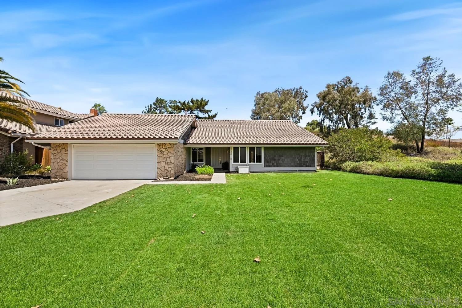 13010 Pomard Way Poway, CA 92064 - Photo 3 of 22 a front view of a house with garden