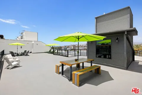 a swimming pool with outdoor seating