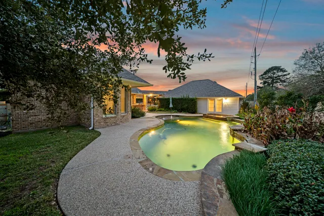 a view of a swimming pool with lounge chair