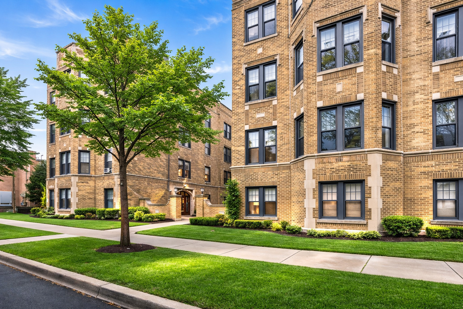 2348 West Addison Street, Unit C2 Chicago, IL 60618 - Photo 1 of 8 a view of a building with a yard