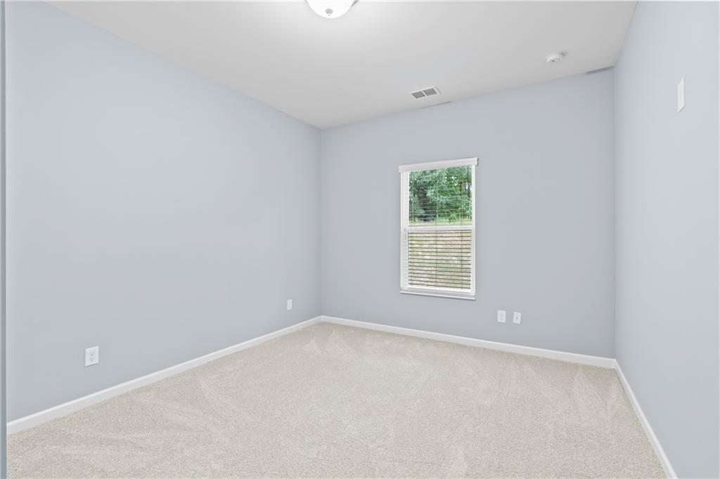 71 Moonrise Crossing Dallas, GA 30132 - Photo 12 of 64 an empty room with a window