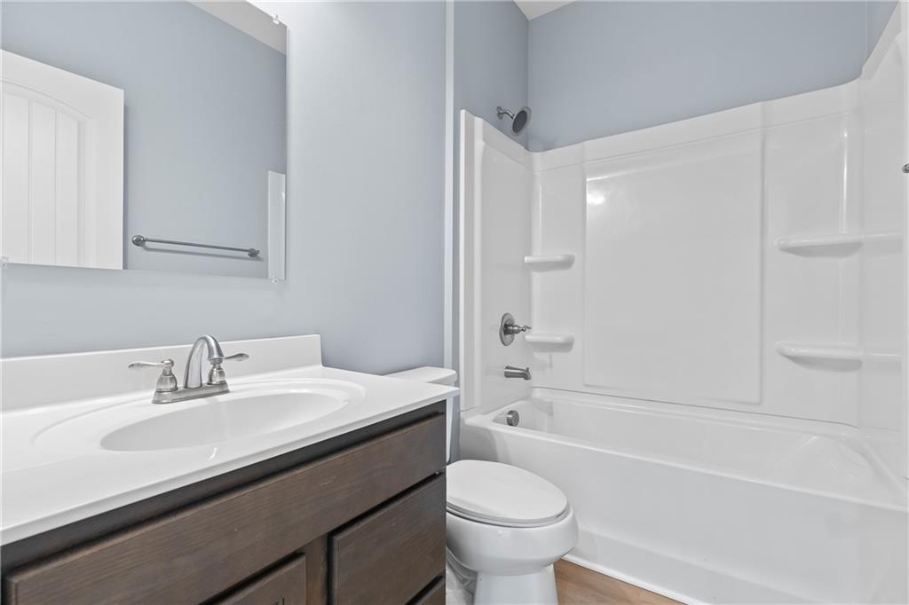 71 Moonrise Crossing Dallas, GA 30132 - Photo 14 of 64 a bathroom with a sink a toilet and a bathtub