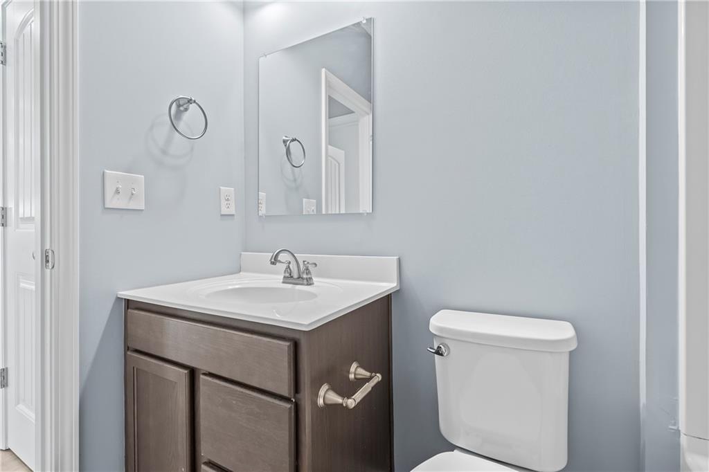 71 Moonrise Crossing Dallas, GA 30132 - Photo 15 of 64 a bathroom with a toilet a sink and mirror