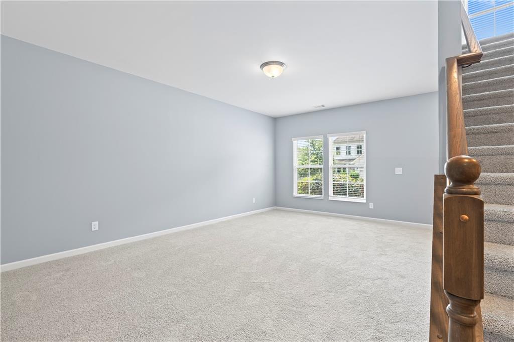 71 Moonrise Crossing Dallas, GA 30132 - Photo 17 of 64 a view of an empty room with a window