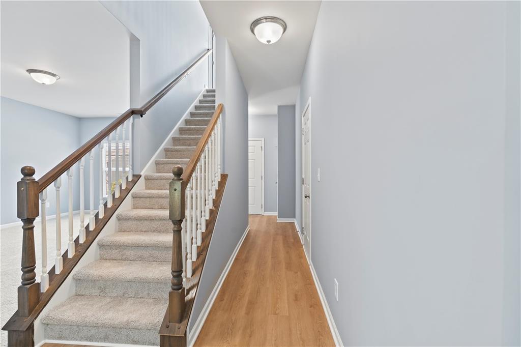 71 Moonrise Crossing Dallas, GA 30132 - Photo 20 of 64 a view of a hallway with wooden floor and entryway