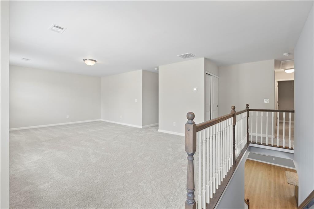 71 Moonrise Crossing Dallas, GA 30132 - Photo 22 of 64 a view of a hallway with staircase