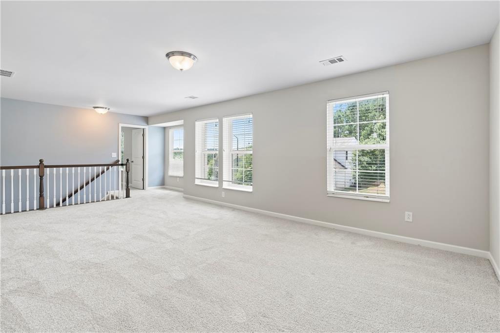 71 Moonrise Crossing Dallas, GA 30132 - Photo 23 of 64 a view of an empty room with a window