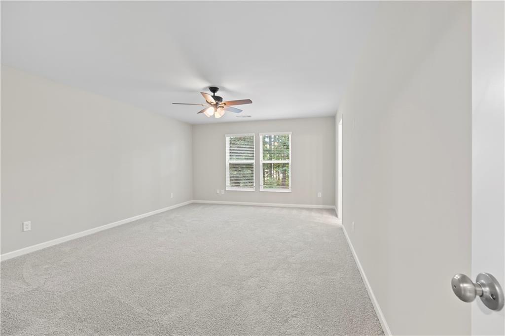 71 Moonrise Crossing Dallas, GA 30132 - Photo 26 of 64 a view of an empty room with a window