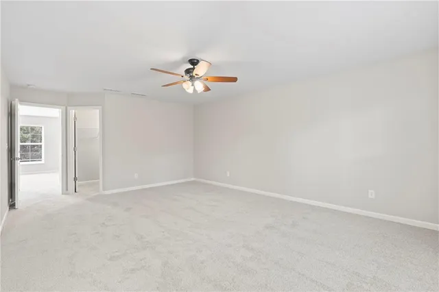 a white bath tub sitting next to a window