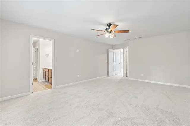 a bathroom with a tub a sink and mirror