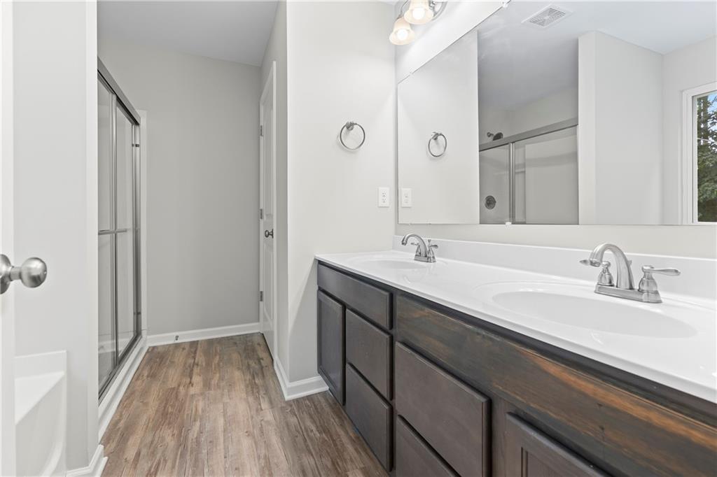 71 Moonrise Crossing Dallas, GA 30132 - Photo 29 of 64 a bathroom with a sink double vanity and a mirror