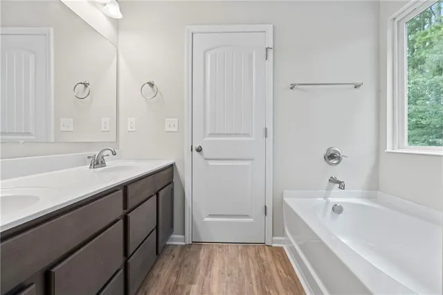 a bathroom with a glass shower door
