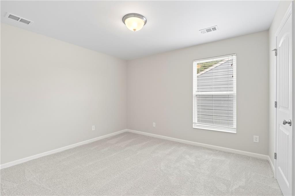 71 Moonrise Crossing Dallas, GA 30132 - Photo 42 of 64 a view of an empty room with a window