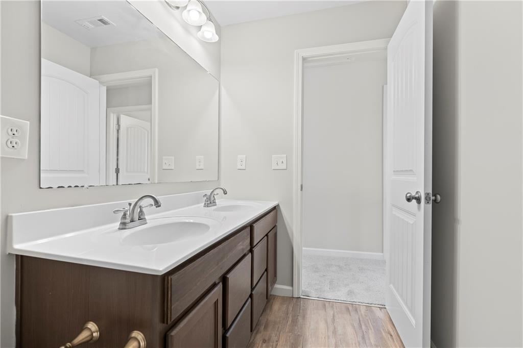 71 Moonrise Crossing Dallas, GA 30132 - Photo 45 of 64 a bathroom with a sink and a mirror