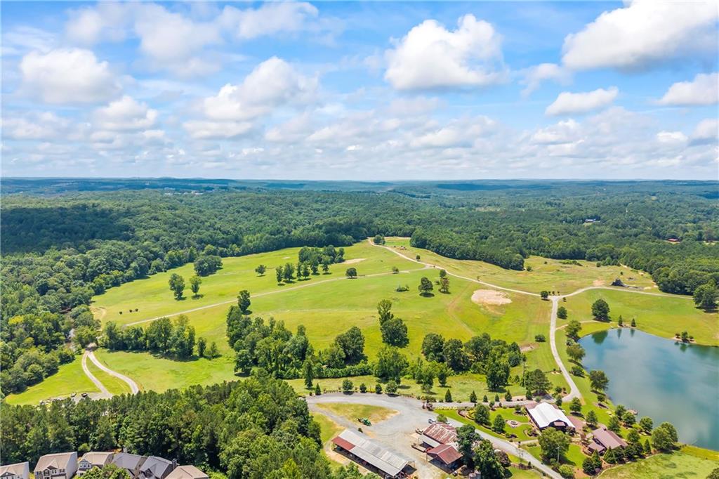 71 Moonrise Crossing Dallas, GA 30132 - Photo 61 of 64 a view of a swimming pool with a garden view