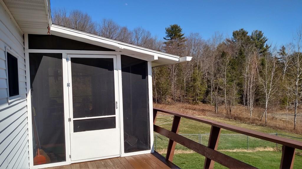 305 Main Road Eddington, ME 04428 - Photo 29 of 35 Deck wraps around to the back