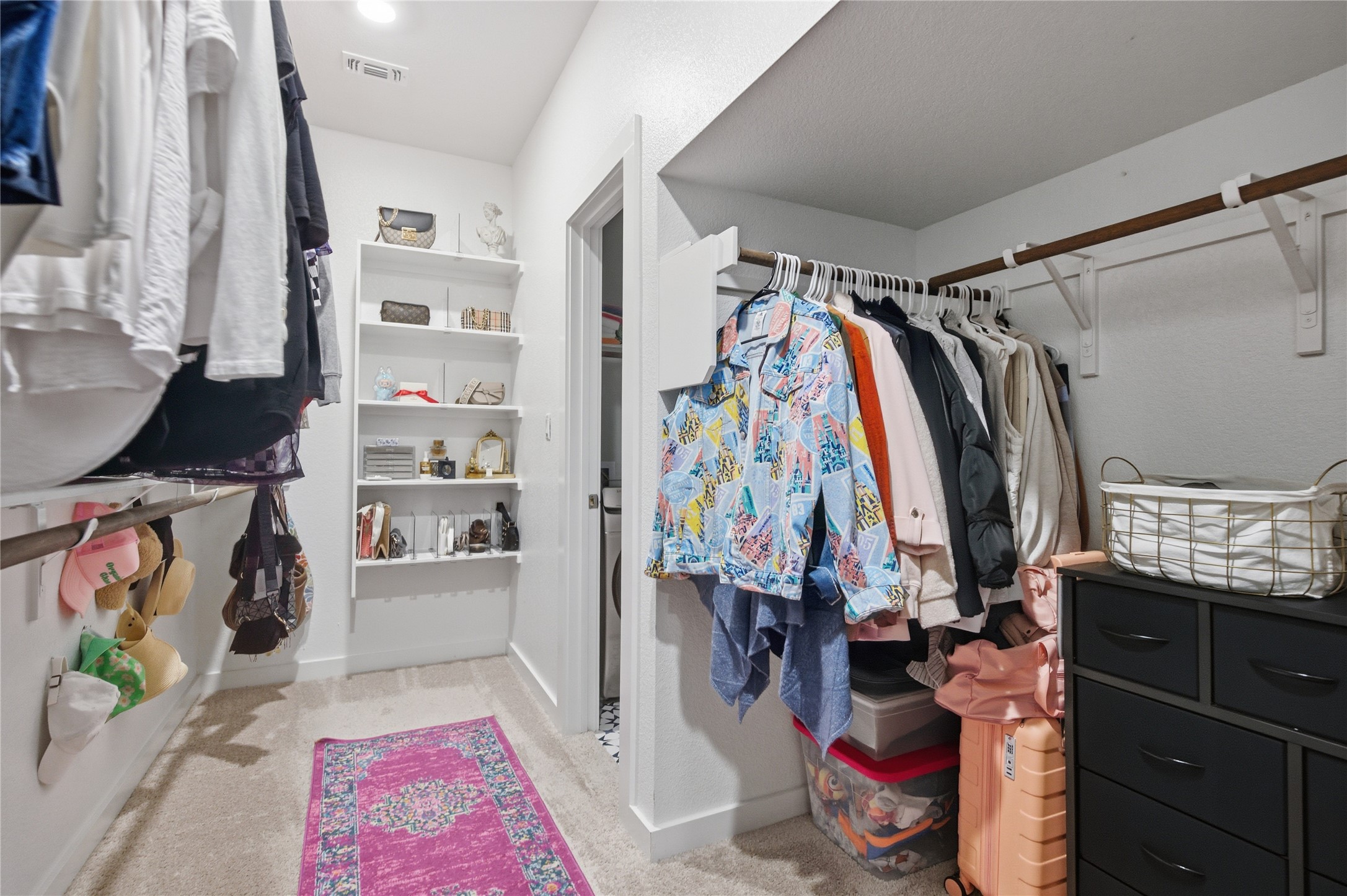 1008 Summer Glen Georgetown, TX 78628 - Photo 21 of 34 a view of walk in closet with clothes and shoes