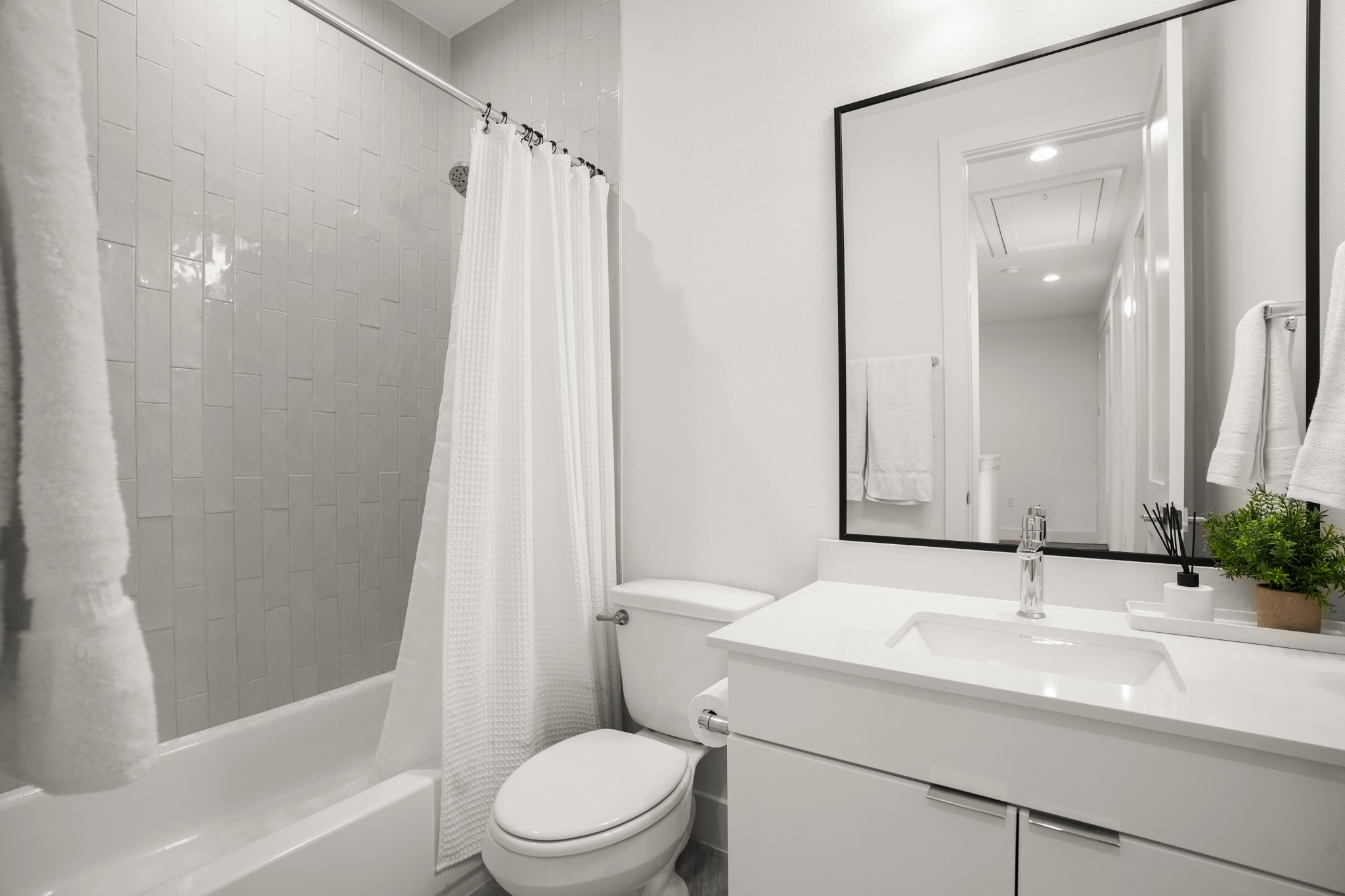 595 Old Mill Road, Unit 206 Cedar Park, TX 78613 - Photo 27 of 39 The full guest bathroom upstairs is shared by the secondary bedrooms and also comes with sleek contemporary finishes.
