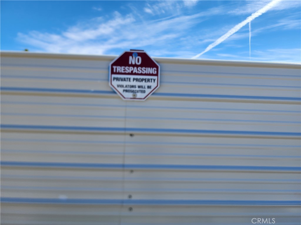 7248 Scarvan Road Yucca Valley, CA 92284 - Photo 6 of 6 a close up of a sign