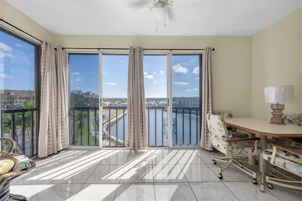 a view of a bedroom with a balcony