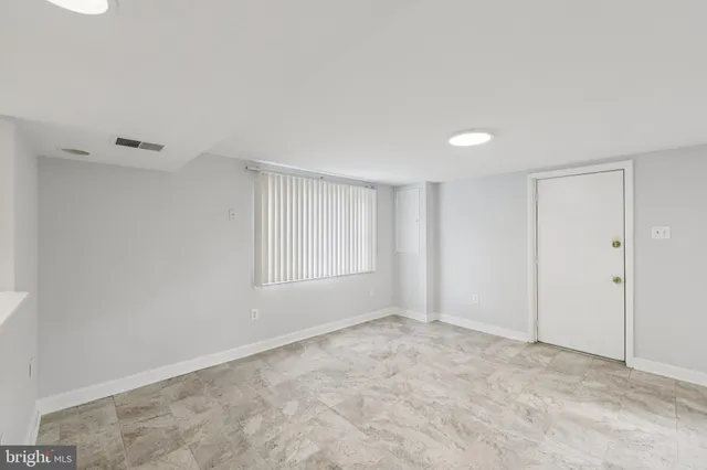 a view of an empty room and window