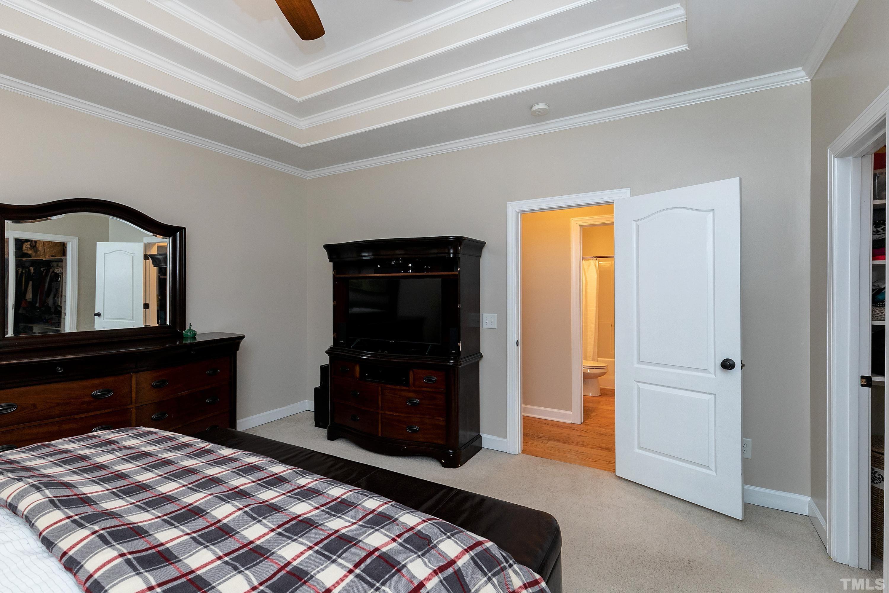 7025 Onslow Stephenson Road Willow Spring, NC 27592 - Photo 12 of 30 a bedroom with a bed and a dresser