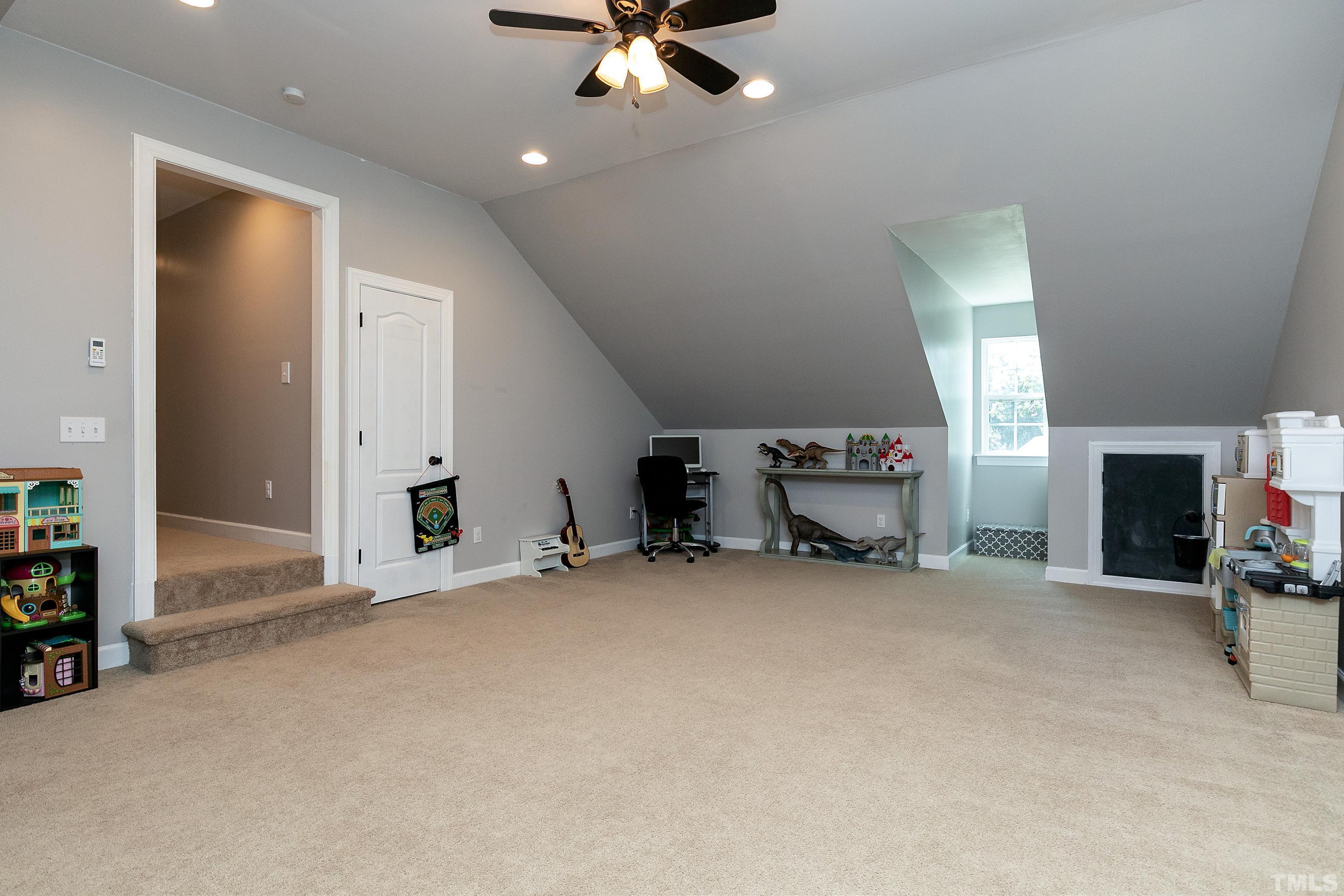 7025 Onslow Stephenson Road Willow Spring, NC 27592 - Photo 22 of 30 a view of a livingroom with a fireplace