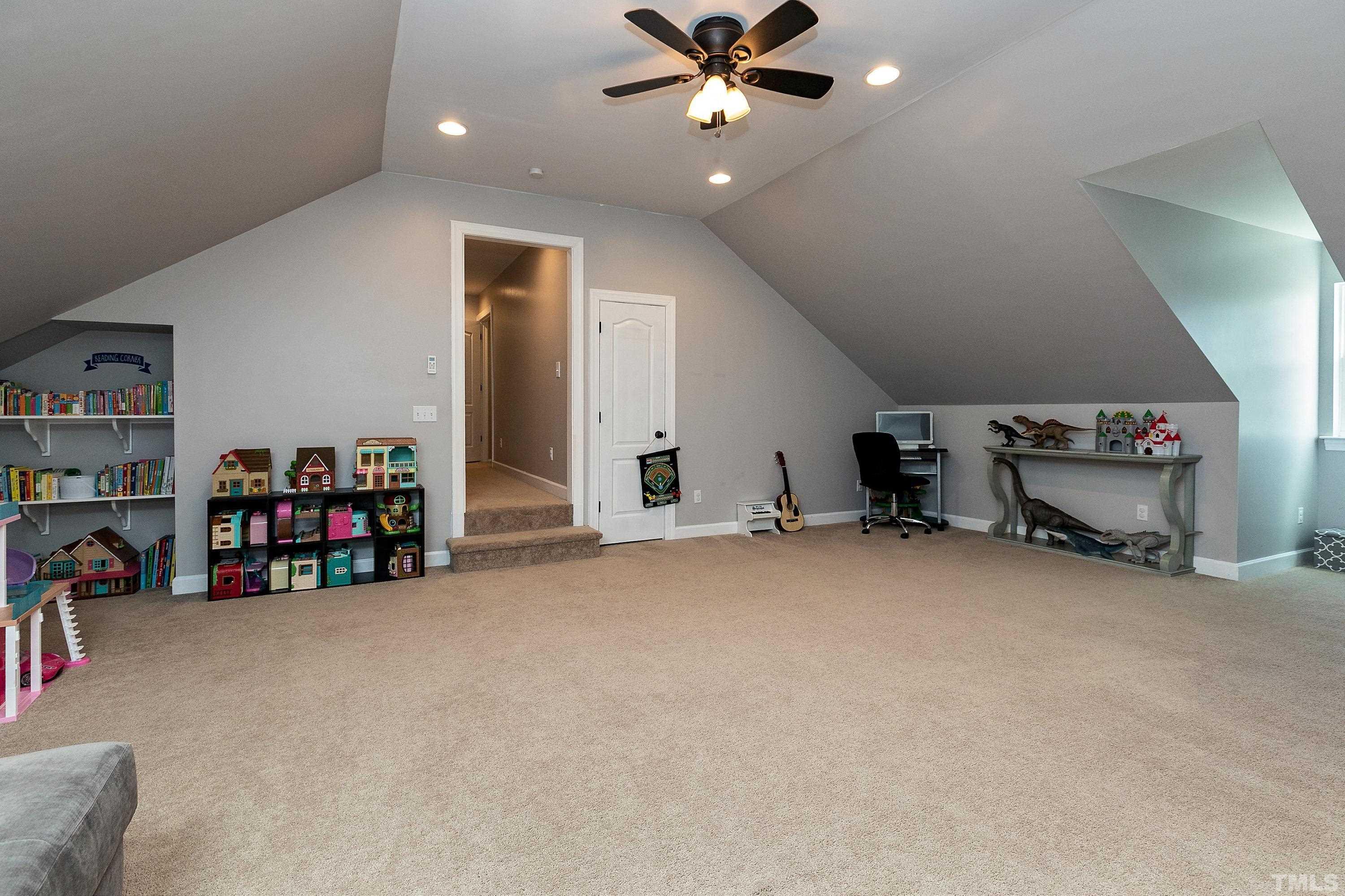 7025 Onslow Stephenson Road Willow Spring, NC 27592 - Photo 23 of 30 a view of a livingroom with gym equipment