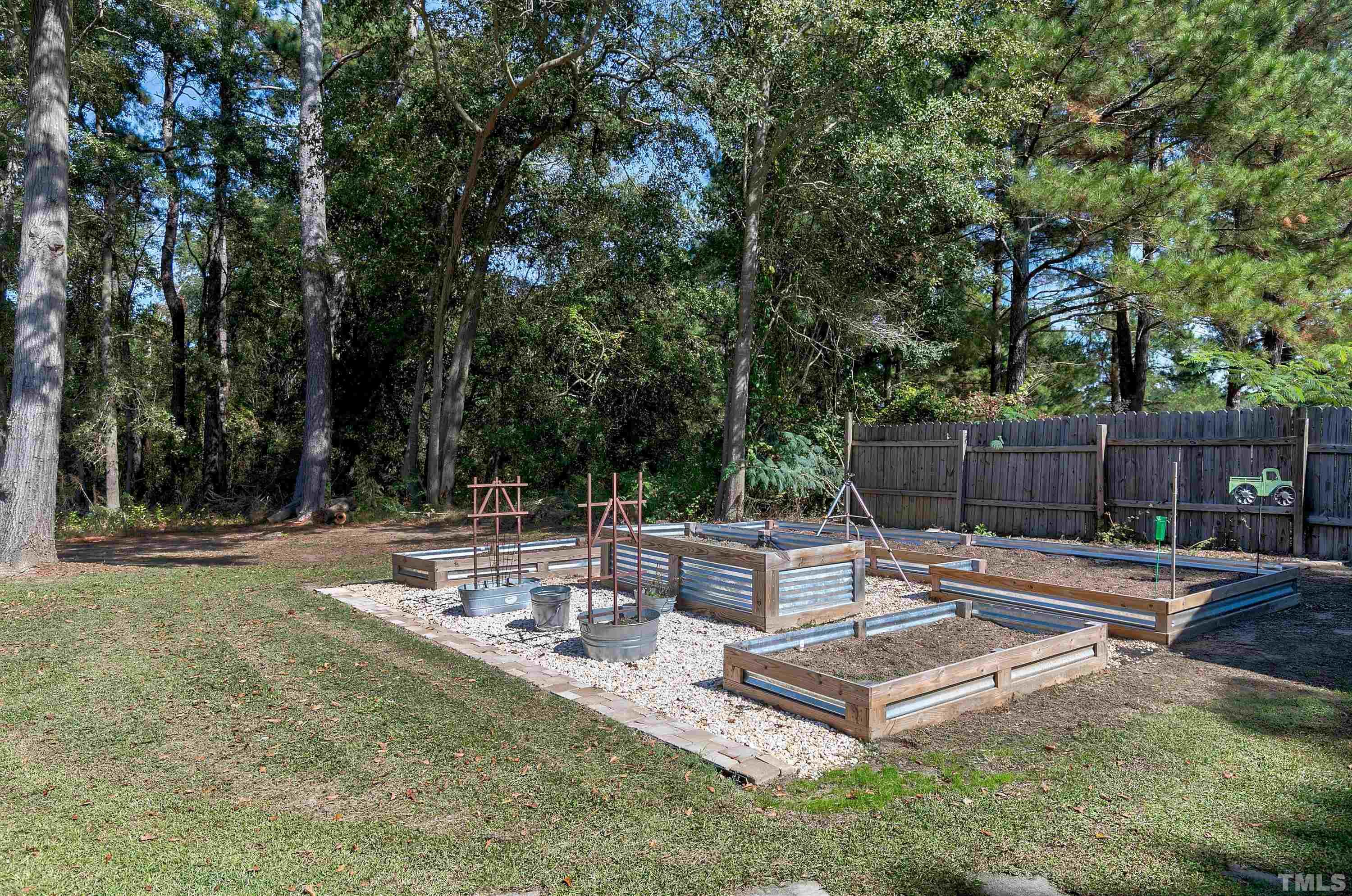 7025 Onslow Stephenson Road Willow Spring, NC 27592 - Photo 26 of 30 a view of a backyard with a patio