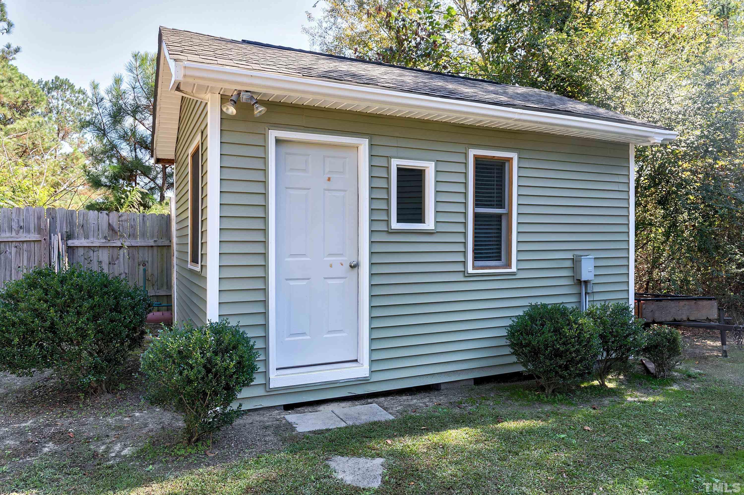 7025 Onslow Stephenson Road Willow Spring, NC 27592 - Photo 29 of 30 a view of a house with a yard