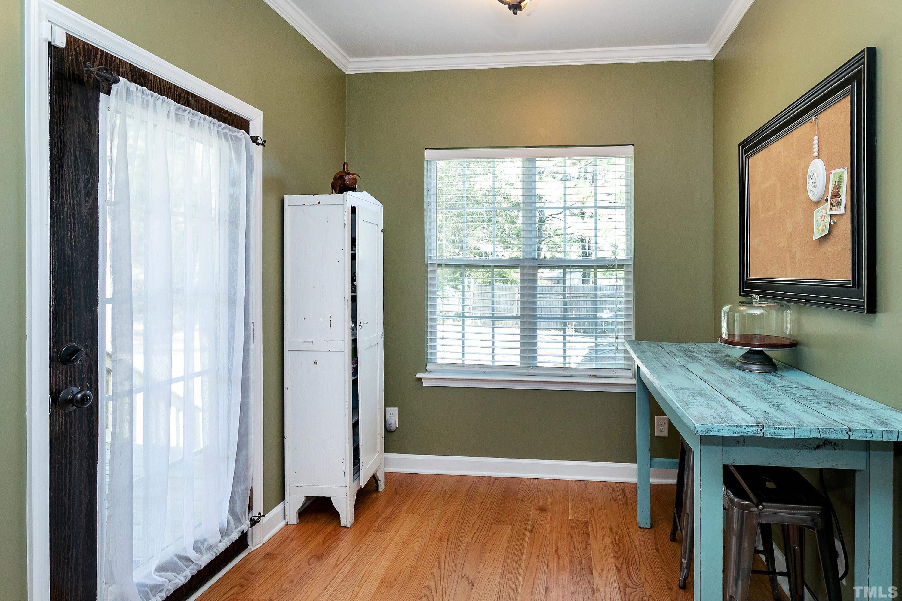 7025 Onslow Stephenson Road Willow Spring, NC 27592 - Photo 8 of 30 a view of kitchen with furniture and wooden floor