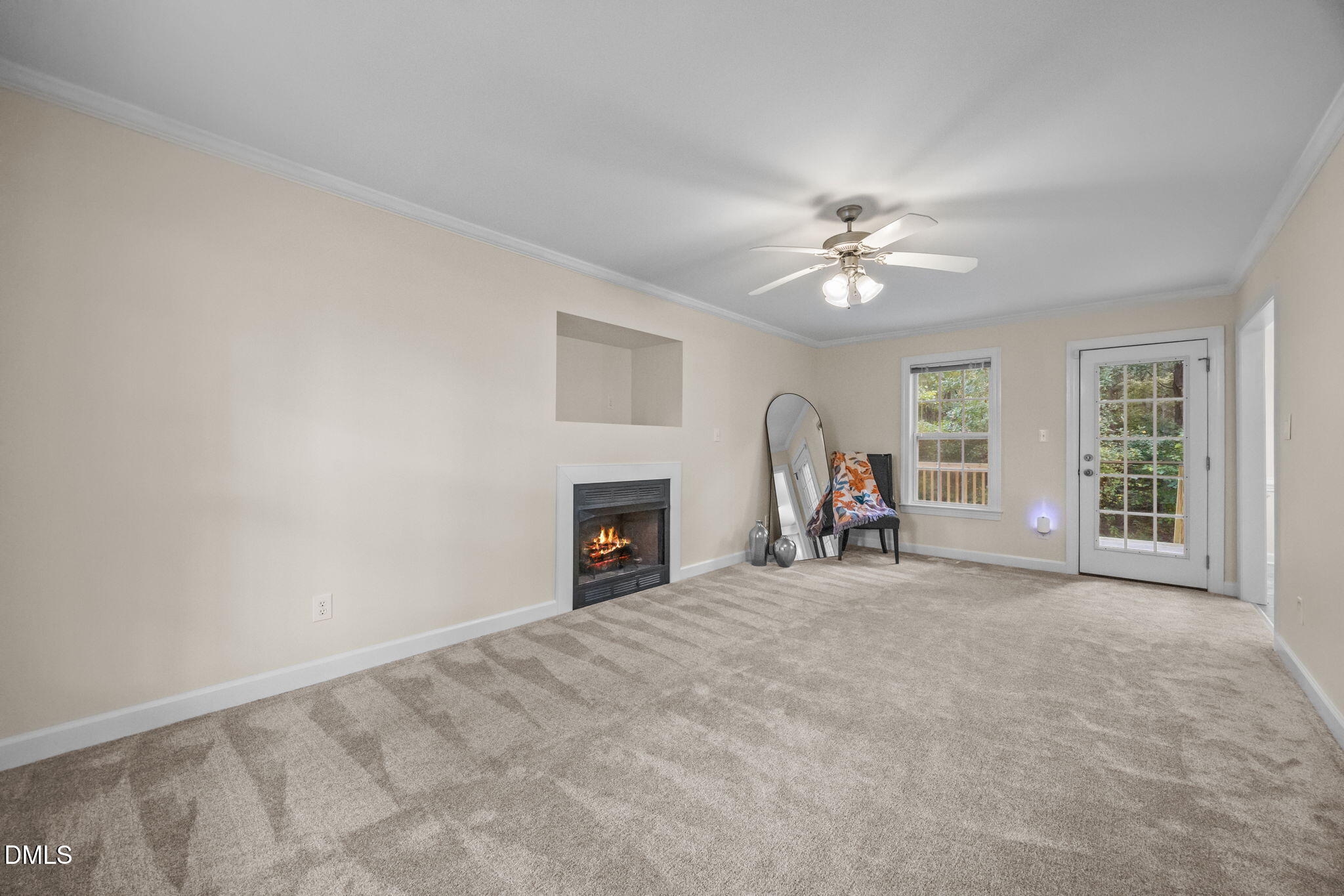 505 Vinson Road Clayton, NC 27527 - Photo 14 of 31 a view of a livingroom with a fireplace and a chandelier