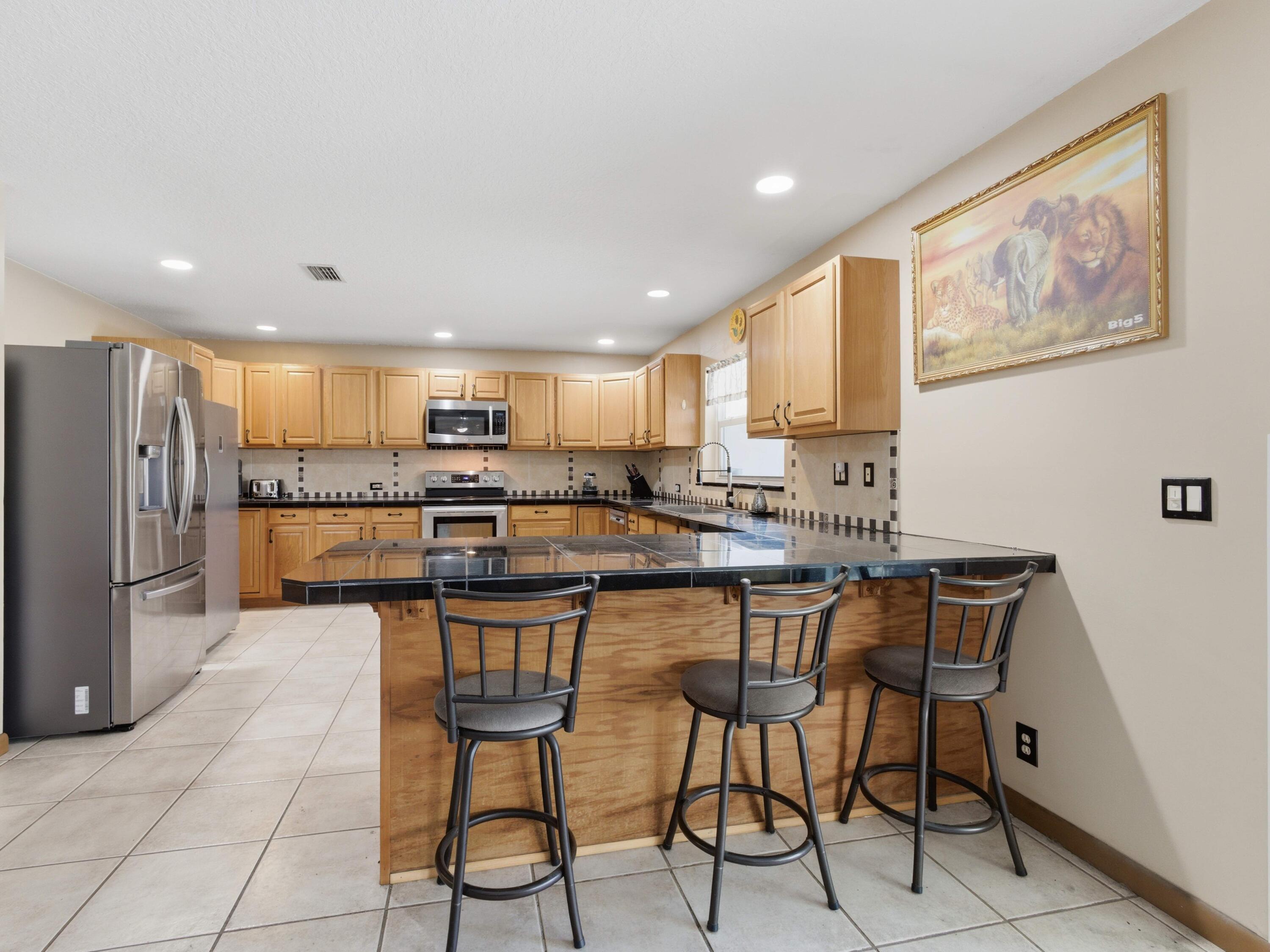 21321 Sawmill Court Boca Raton, FL 33498 - Photo 13 of 56 Breakfast Bar Kitchen
