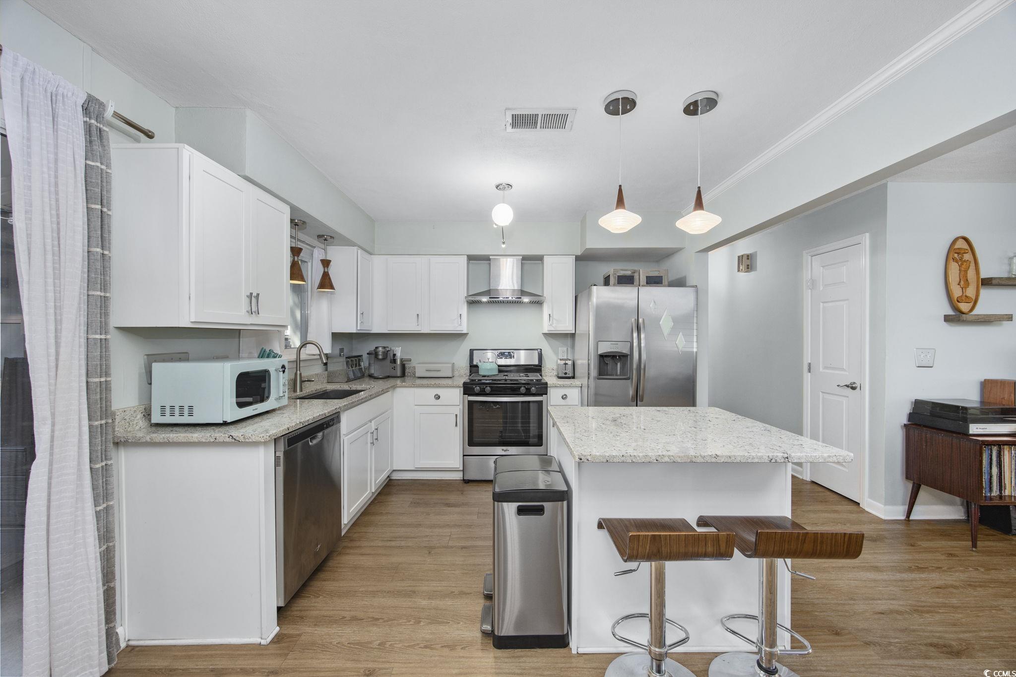 406 Sunset Trail Myrtle Beach, SC 29577 - Photo 7 of 24 Kitchen with island, granite countertops & stainle