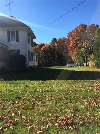 15 3rd Street Ayer, MA 01432 - Photo 4 of 8 a view of a house with a yard