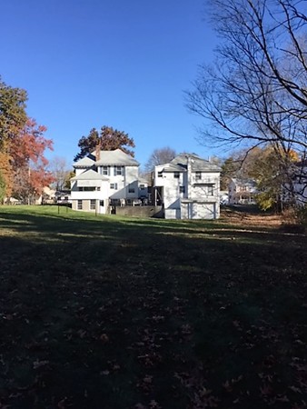 15 3rd Street Ayer, MA 01432 - Photo 5 of 8 a view of a table and chairs in back yard of the house