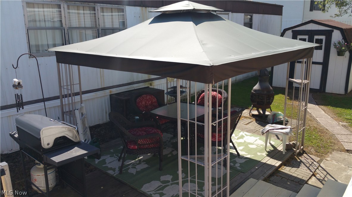 100 Keenan Road, Unit ASH22 Peninsula, OH 44264 - Photo 7 of 15 Gazebo with newer top. Gazebo stays, but not the furniture
