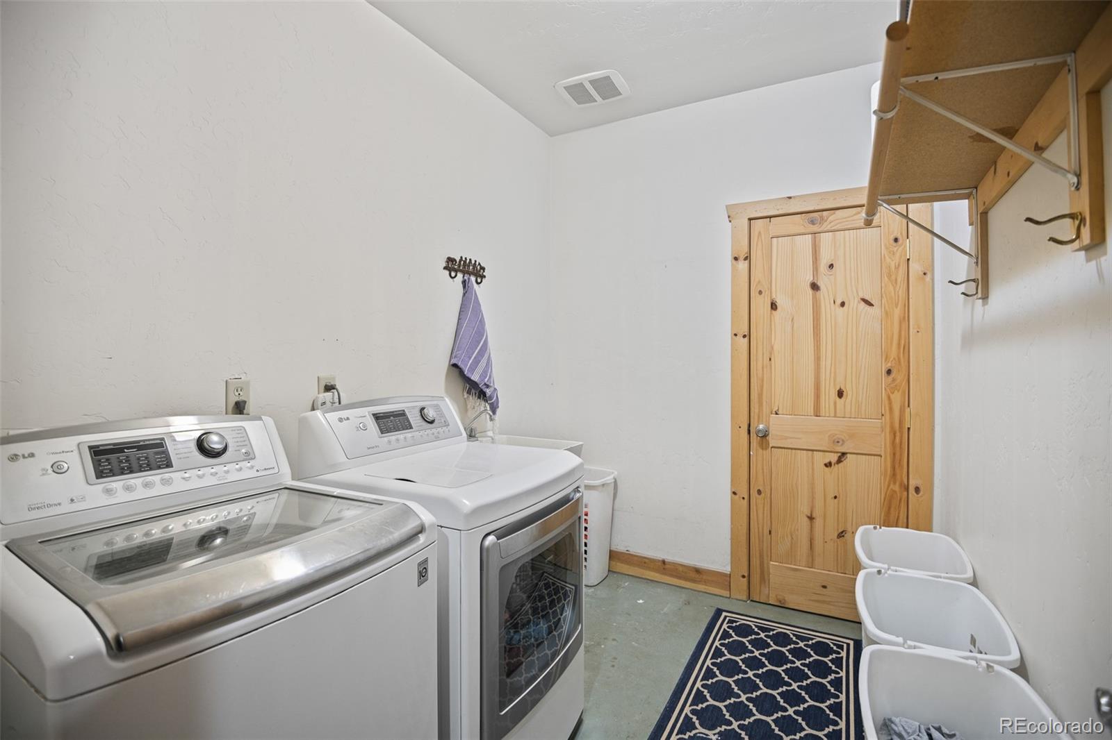 13434 Baird Road Conifer, CO 80433 - Photo 26 of 36 a utility room with dryer and washer