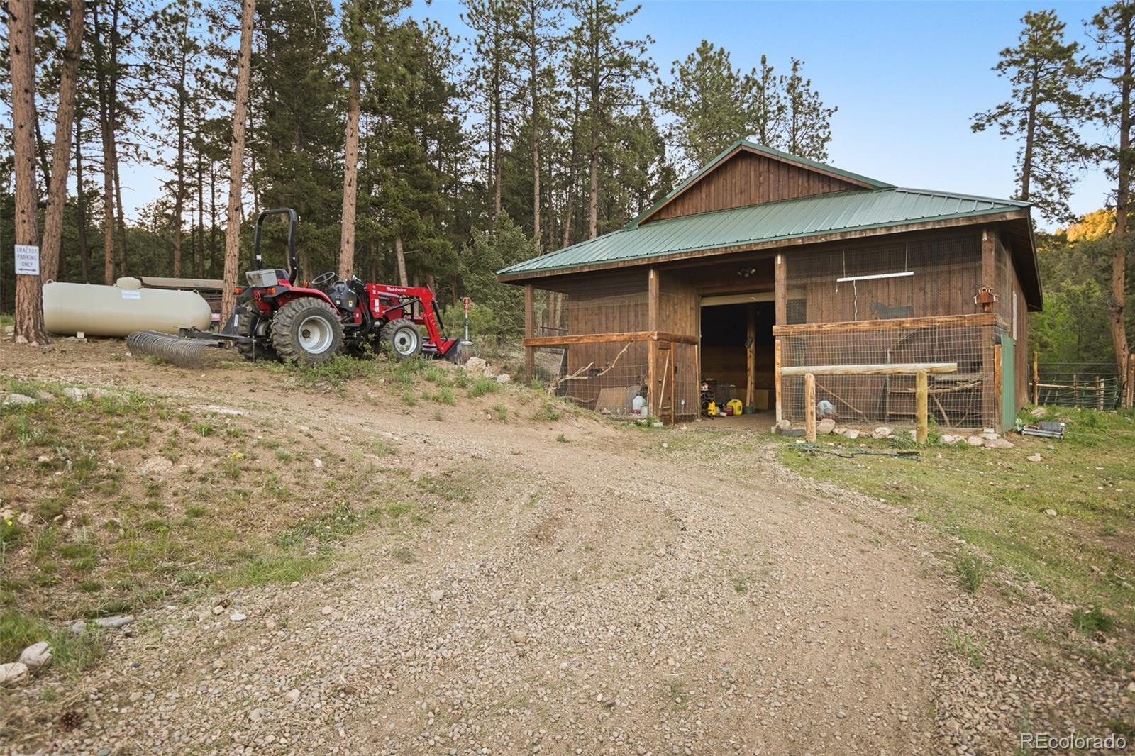 13434 Baird Road Conifer, CO 80433 - Photo 32 of 36 a front view of a house with garden