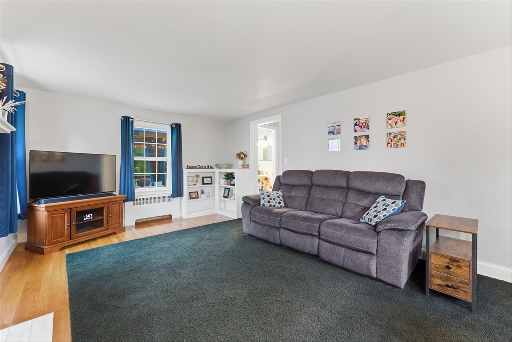 54 Churchill Road West Springfield, MA 01089 - Photo 16 of 42 a living room with furniture and a flat screen tv