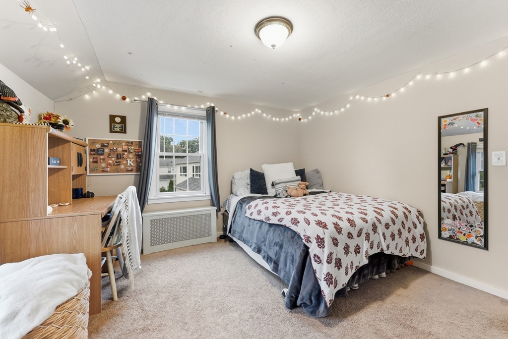 54 Churchill Road West Springfield, MA 01089 - Photo 24 of 42 a spacious bedroom with a bed and a desk