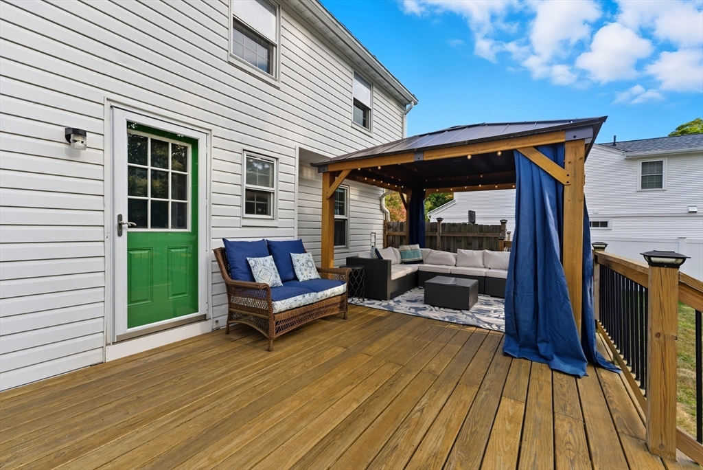 54 Churchill Road West Springfield, MA 01089 - Photo 31 of 42 a backyard of a house with wooden floor and outdoor seating