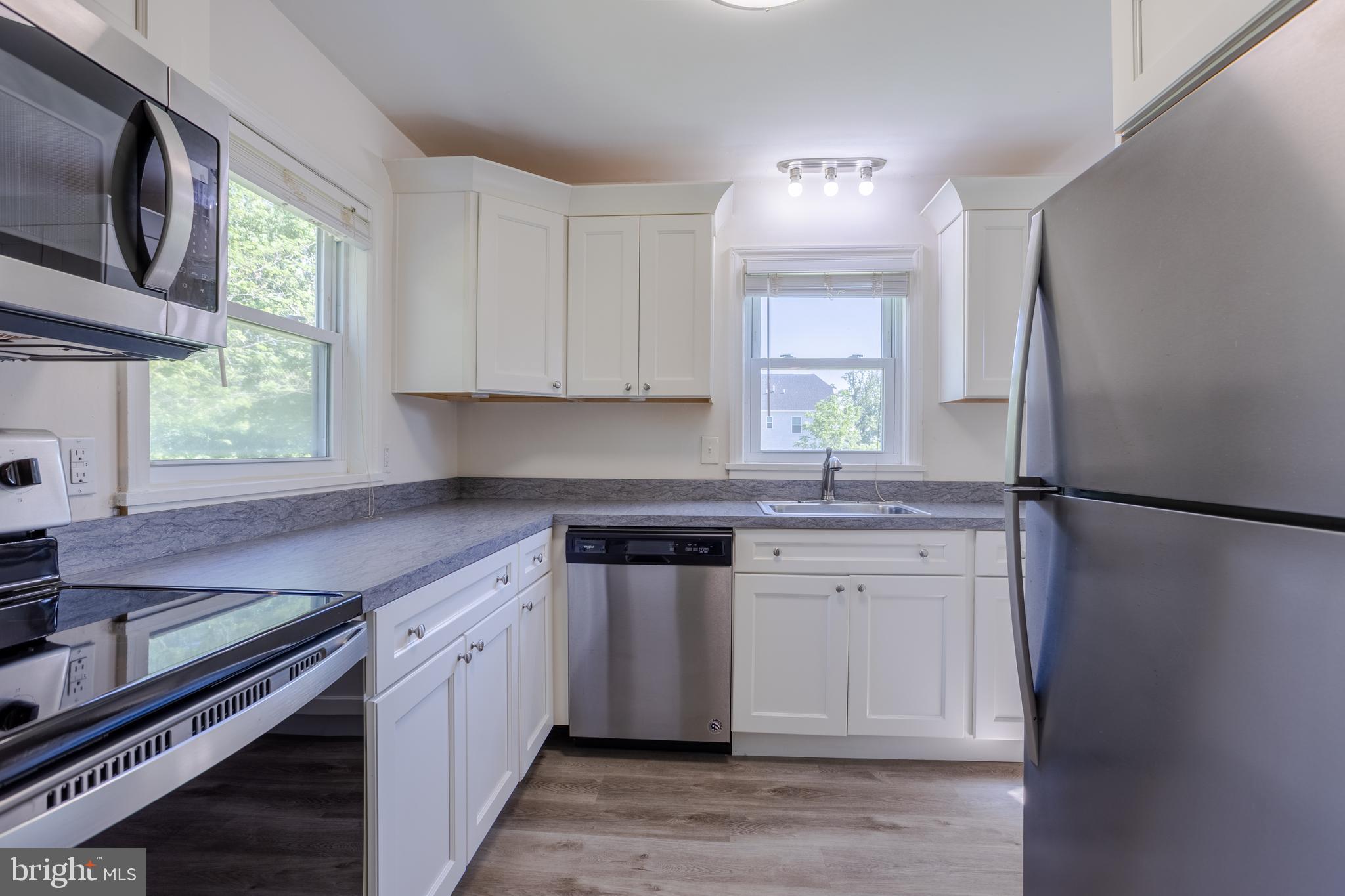 3612 Churchville Road Aberdeen, MD 21001 - Photo 11 of 49 a kitchen with stainless steel appliances granite countertop a stove a sink and a refrigerator