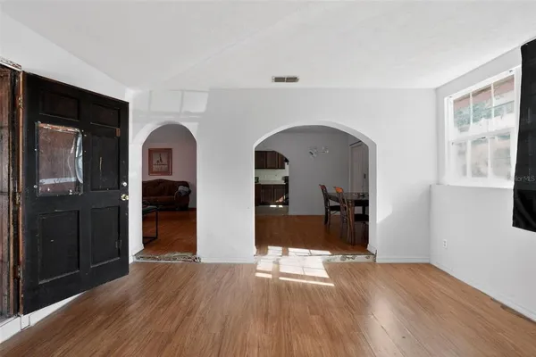a view of entryway with livingroom and wooden floor