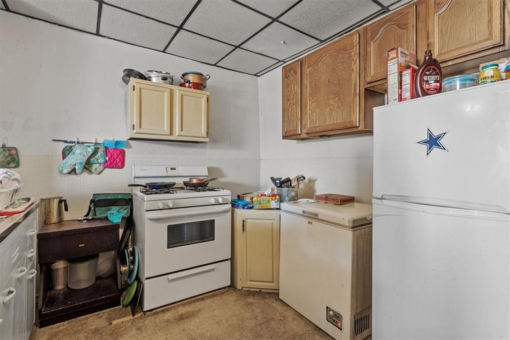 701 Freeport Road Creighton, PA 15030 - Photo 12 of 26 a kitchen with a stove and a refrigerator