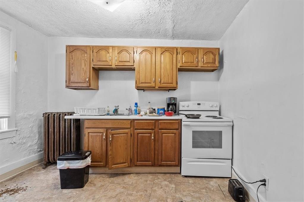 701 Freeport Road Creighton, PA 15030 - Photo 25 of 26 a kitchen with a sink and a stove
