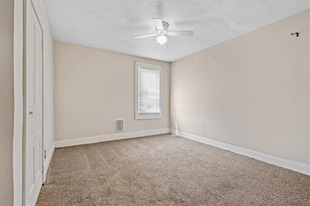 701 Freeport Road Creighton, PA 15030 - Photo 4 of 26 an empty room with windows and fan